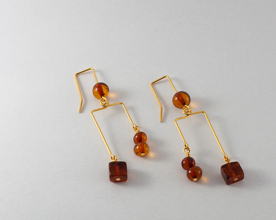 A pair of Blodughadda goldplated earrings on white background.